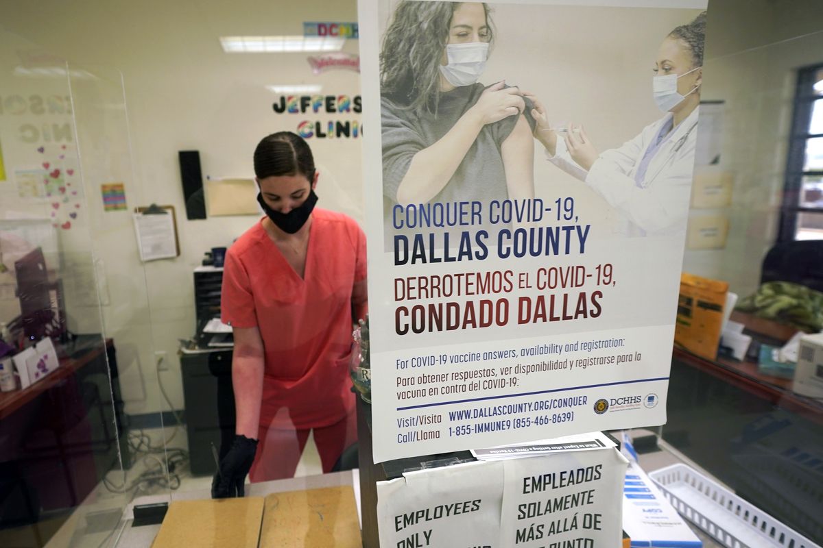 A Dallas County Health and Human Services nurse completes paperwork after administering a Pfizer COVID-19 vaccine at a county run vaccination site in Dallas, Thursday, Aug. 26, 2021.  (LM Otero)