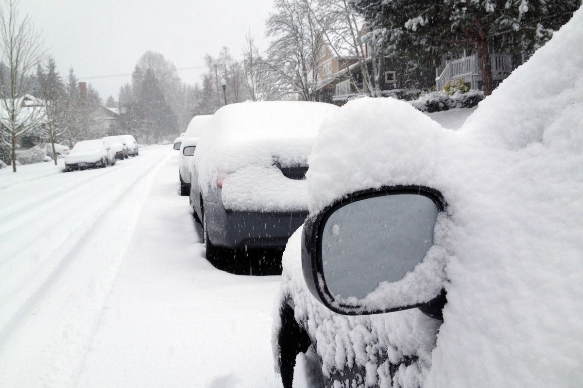 Snow blankets cars and homes in Tacoma, Wash., today. A widespread snowstorm walloped western Washington today with the heaviest blow missing Seattle and hitting the Olympia area, causing accidents, closing schools and canceling flights at Sea-Tac Airport. (AP/Ted S. Warren)