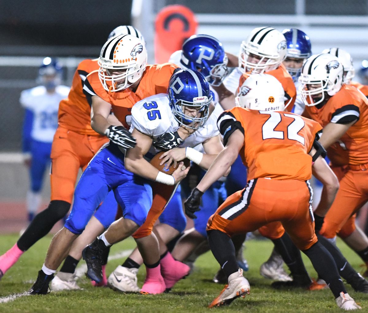 Pullmans Ty Hendrickson (35) batters his way through West Valley defenders, including Ethan Rehn (22), Friday, Oct. 12, 2018, at West Valley High School. (Jesse Tinsley / The Spokesman-Review)