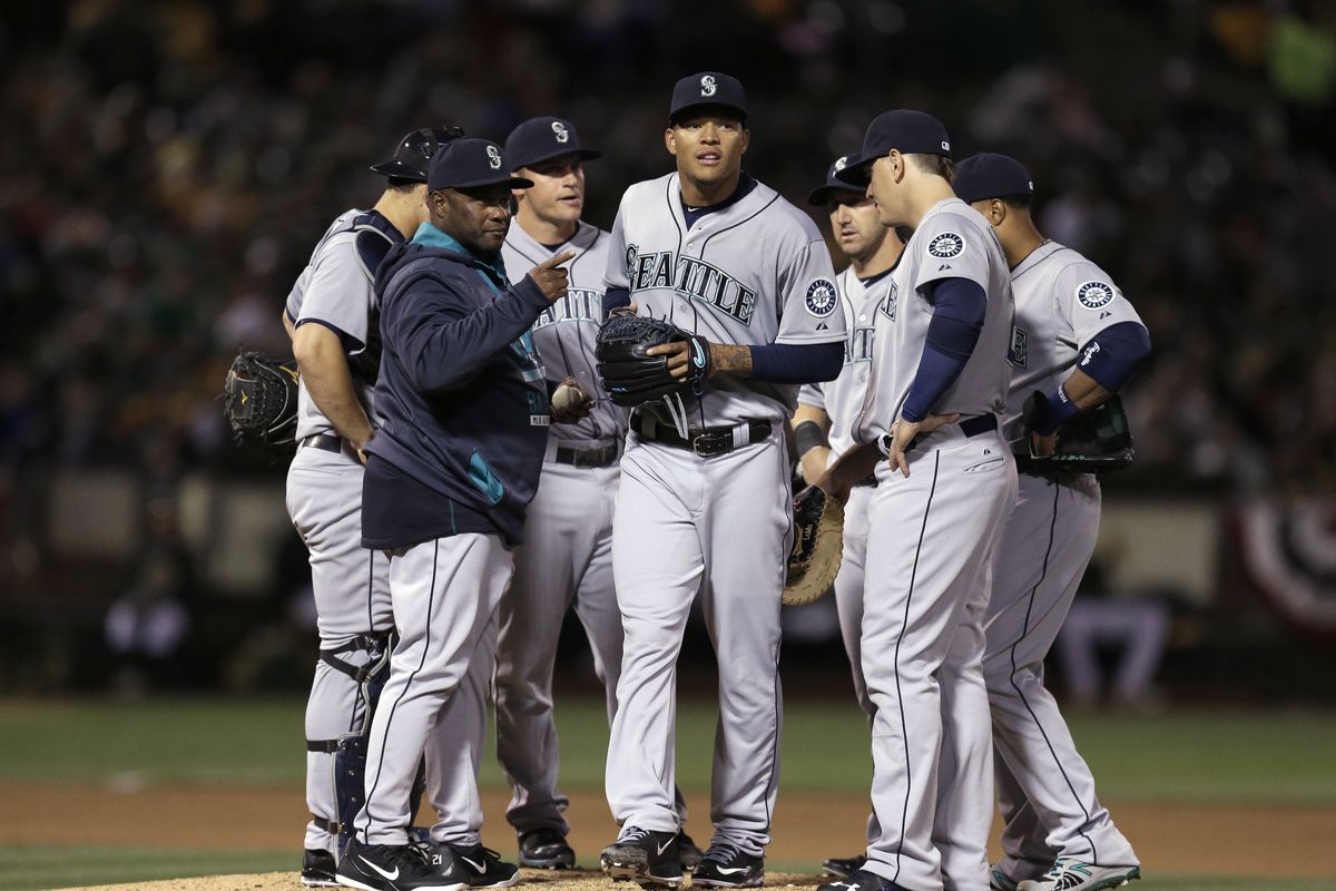 Mariners starting pitcher Taijuan Walker exits in the fourth inning after giving up nine runs. (Associated Press)