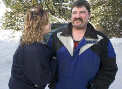 
Marcy Naccarato hugs her husband, Ken, on Friday.  He and a 15-year-old neighbor were rescued from Mica Peak Friday morning after Naccarato's snowmobile became stuck Thursday night. 
 (Christopher Anderson/ / The Spokesman-Review)