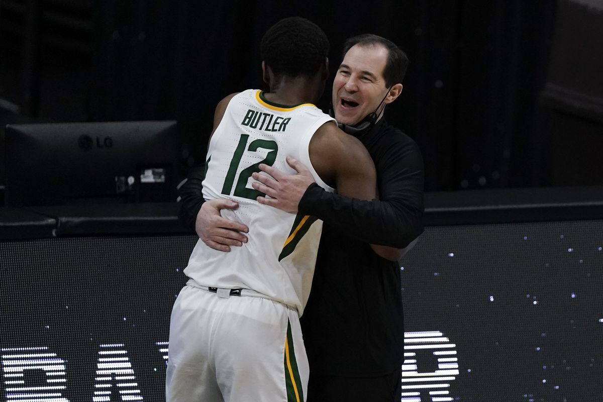 Baylor guard Jared Butler (12) gets a hug from head coach Scott Drew during the second half of a men