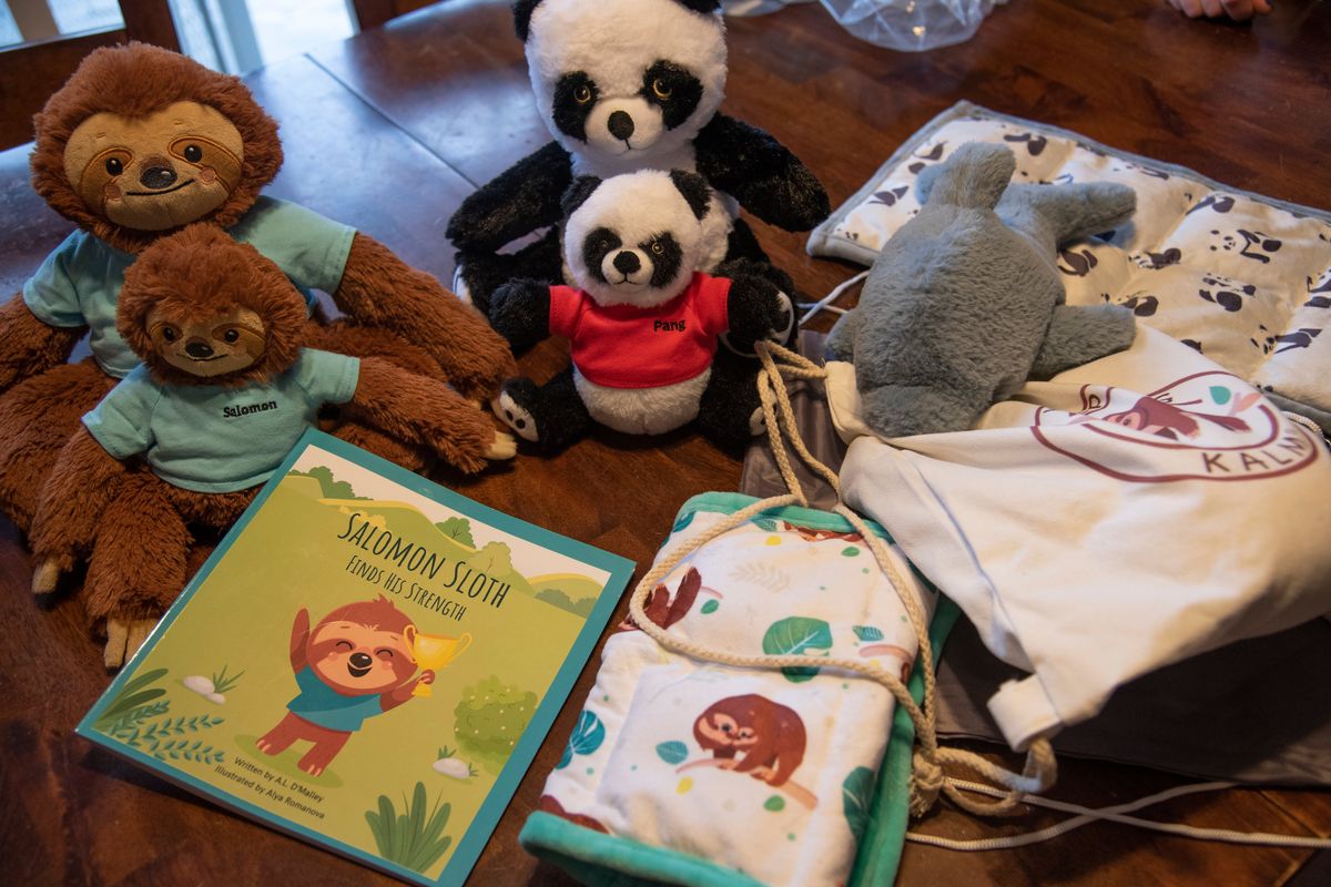 Andrea Alley designed a series of classroom aids for children with anxiety. Her line has weighted lap pads, weighted stuffed animals and, most recently, her book to go with the stuffed sloth character.  (Jesse Tinsley/THE SPOKESMAN-REVIEW)