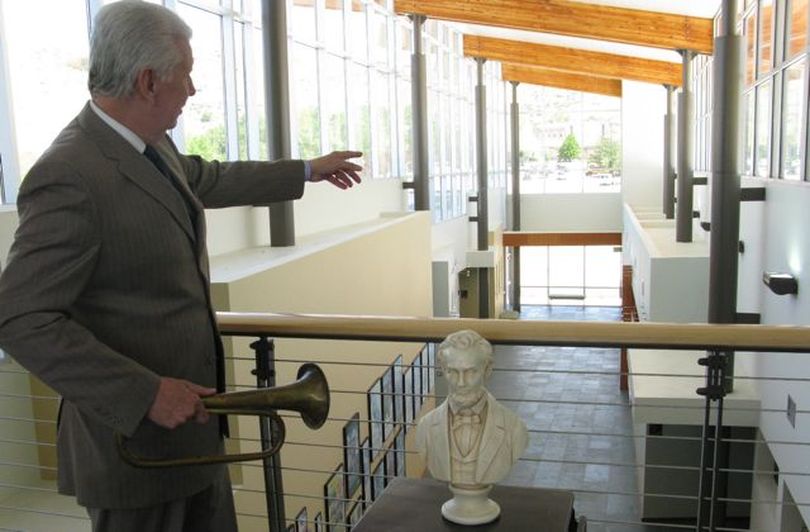 David Leroy, with a couple of items from the Lincoln collection, points to where a new Lincoln Legacy gallery will be constructed at the Idaho State Archives. (Betsy Russell)