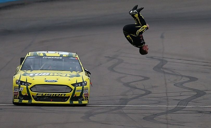 Carl Edwards, driver of the #99 Subway Ford, performs a back flip to celebrate after winning the NASCAR Sprint Cup Series Subway Fresh Fit 500 at Phoenix International Raceway on March 3, 2013 in Avondale, Arizona. (Photo Credit: Jerry Markland/Getty Images) (Jonathan Ferrey / Getty Images North America)
