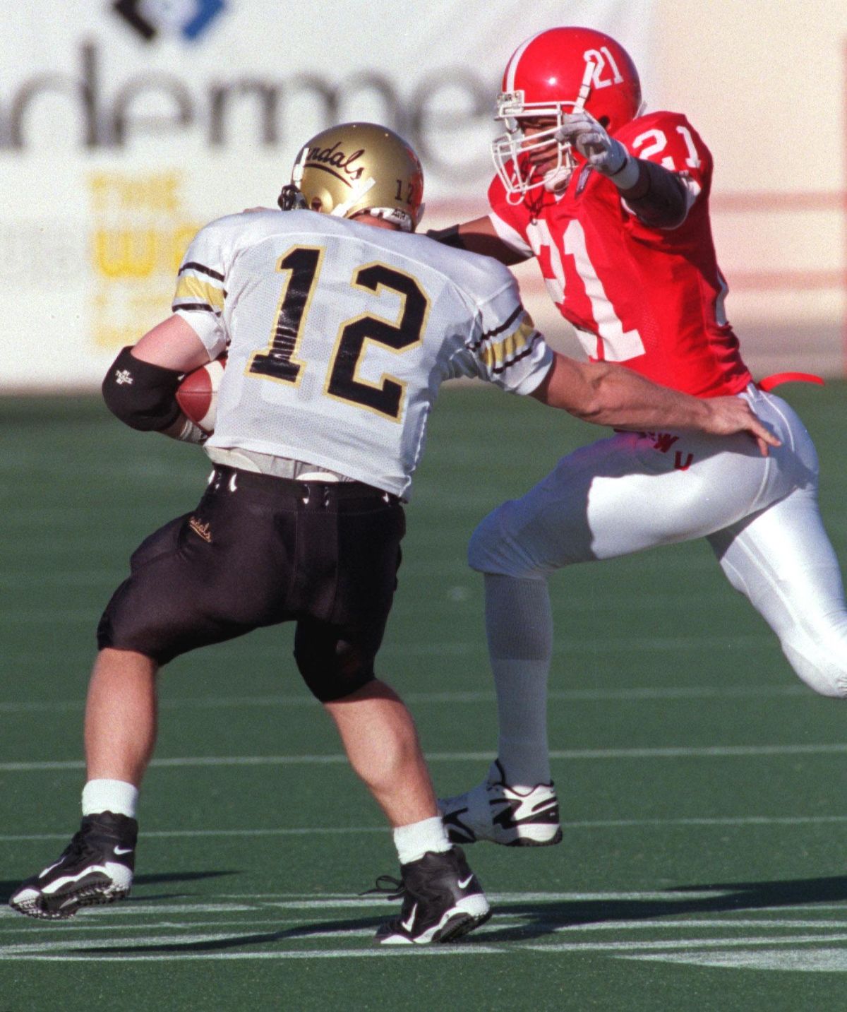 Eastern Washington’s Jimmy Lake runs down Idaho quarterback Ed Dean during a 1997 game at Albi Stadium.