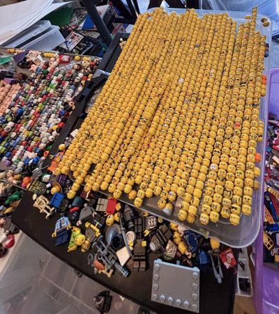 A tray of Lego mini-figurine heads, some of the tens of thousands of pieces and sets police found at a home in Lake County, Calif.  (Santa Rosa Police Department)