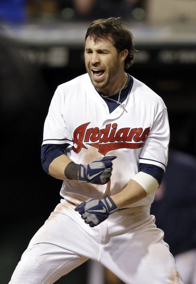 Cleveland’s Jason Kipnis celebrates his game-winning home run in the 10th inning. (Associated Press)