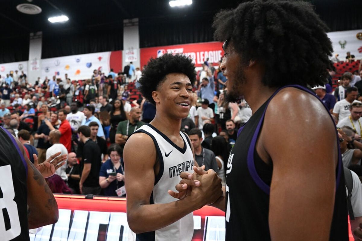 Memphis guard Jaylen Wells (0) shakes hands with his former WSU teammate Sacramento forward Isaac Jones (17) during an NBA Summer League matchup on Friday, Jul. 12, 2024, at Cox Pavilion in Las Vegas, Nev.  (Tyler Tjomsland / The Spokesman-Review)