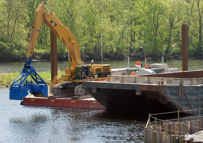 Dredges begin to remove PCB-laden sediment Friday from the upper Hudson River at Fort Edward, N.Y., more than three decades after the oily chemicals fouled the waterway. The work will continue around the clock every day but Sunday for at least six years.  (Associated Press / The Spokesman-Review)