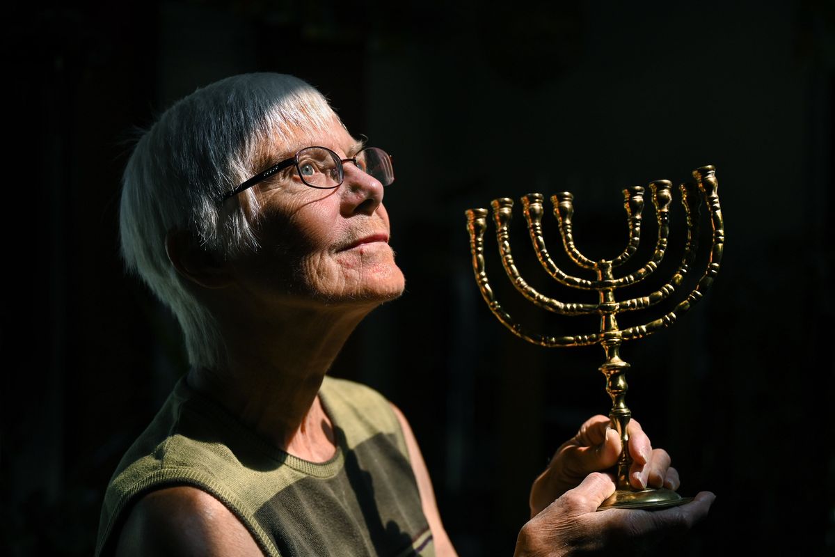 Sharon Moses holds the first menorah she acquired in her collection. It was found in a Dayton, Ohio, thrift store in 1967.  (DAN PELLE/THE SPOKESMAN-REVIEW)