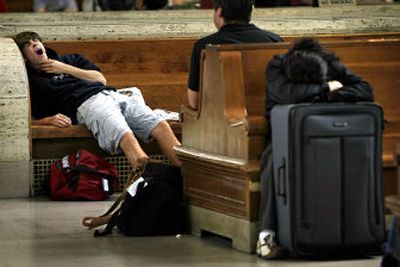 
Peter McHugh yawns as he waits in Philadelphia on Thursday for a train. A major power outage Thursday stranded thousands of rush-hour commuters between New York and Washington, D.C. 
 (Associated Press / The Spokesman-Review)
