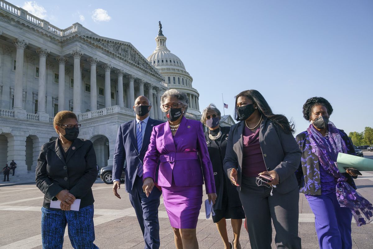 Members of the Congressional Black Caucus walk Tuesday to make a make a statement on the verdict in the murder trial of former Minneapolis police Officer Derek Chauvin on Capitol Hill in Washington.  (J. Scott Applewhite)
