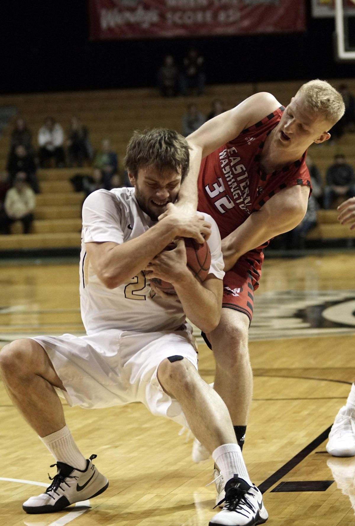 Idaho forward Arkadiy Mkrtychyan (21) and Eastern Washington’s Bogdan Bliznyuk battle for the ball Friday night in Moscow. (Kai Eiselein / Moscow-Pullman Daily News)