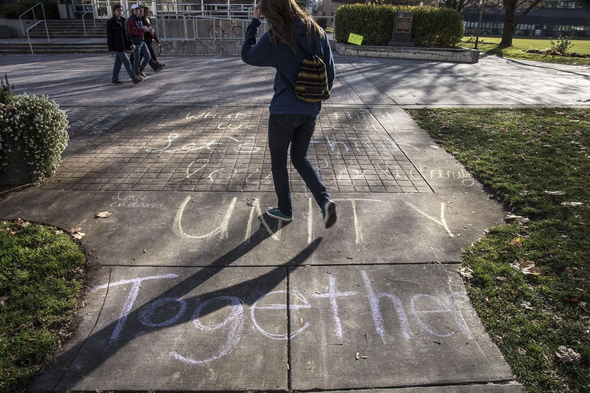 Chalk messages of unity cover the sidewalks near the Crosby Center on the Gonzaga University campus, Friday, Nov. 11, 2016, in Spokane, Wash. (Dan Pelle / The Spokesman-Review)