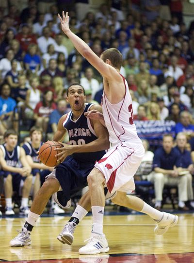 Gonzaga forward Elias Harris (20) attempts to drive past Wisconsin forward Jon Leuer (30) in the second half of a NCAA college basketball game Tuesday Nov. 24, 2009 at the Maui Invitational in Lahaina, Hawaii. Gonzaga defeats Wisconsin 74-61 and will play Cincinnati in the finals. (Eugene Tanner / Fr168001 Ap)