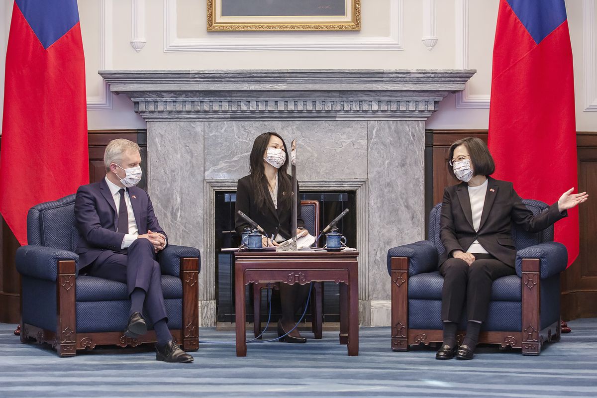 In this photo released by the Taiwan Presidential Office, Taiwan president Tsai Ing-wen, right, chats with Francois de Rugy, the head of the Taiwan Friendship group in the National Assembly, the lower house of France's Parliament, during a visit at the Presidential Office in Taipei, Taiwan, Dec. 16, 2021. Rugy is who is leading a team of French lawmakers from the French National Assembly on a five-day visit to Taiwan.  (HOGP)