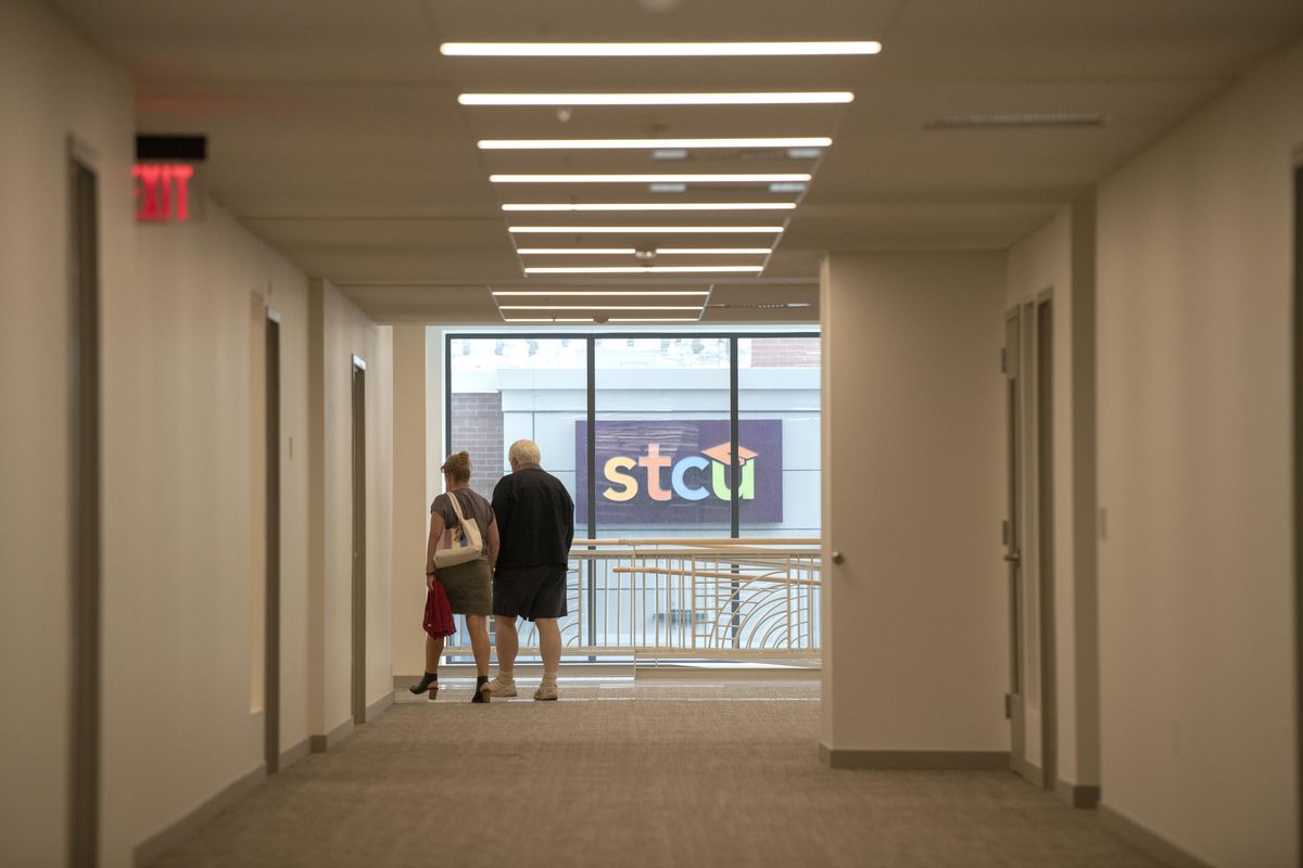 Pedestrians walk through the hallway that allows people to walk through the M building from River Park Square to the Bennett Block, shown Friday, Oct. 5, 2018. (Jesse Tinsley / The Spokesman-Review)