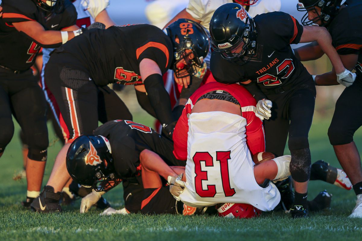 Sandpoint’s Garrit Cox ends up on his head after scoring on a 1-yard run against Post Falls on Friday at Post Falls.  (Cheryl Nichols/For The Spokesman-Review)