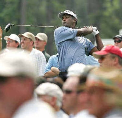 
Defending champ Vijay Singh tees off on the seventh hole.
 (Associated Press / The Spokesman-Review)