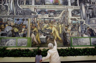 
A museum volunteer points out a small detail on the industrial murals painted by Diego Rivera at the Detroit Institute of Art, where visitors to Super Bowl XL can find an educational experience outside of normal Super Bowl festivities. 
 (Associated Press / The Spokesman-Review)