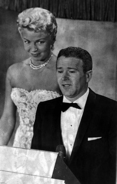 
With Lana Turner looking on, Red Buttons accepts his Academy Award for best supporting actor of 1957. 
 (Associated Press / The Spokesman-Review)
