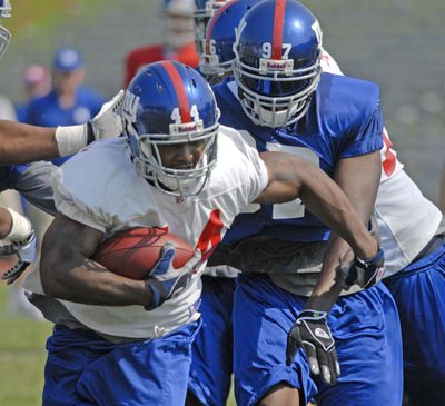 It’s back to jail for Ahmad Bradshaw  at season’s end.  (Associated Press / The Spokesman-Review)