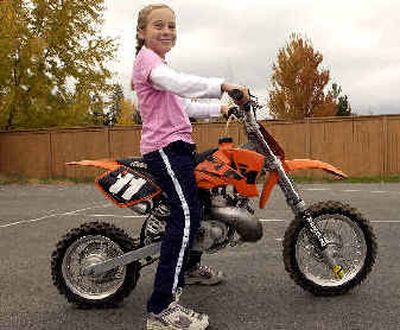 
Courtney Bissel has been riding in motocross races for two years. 
 (Jesse Tinsley / The Spokesman-Review)