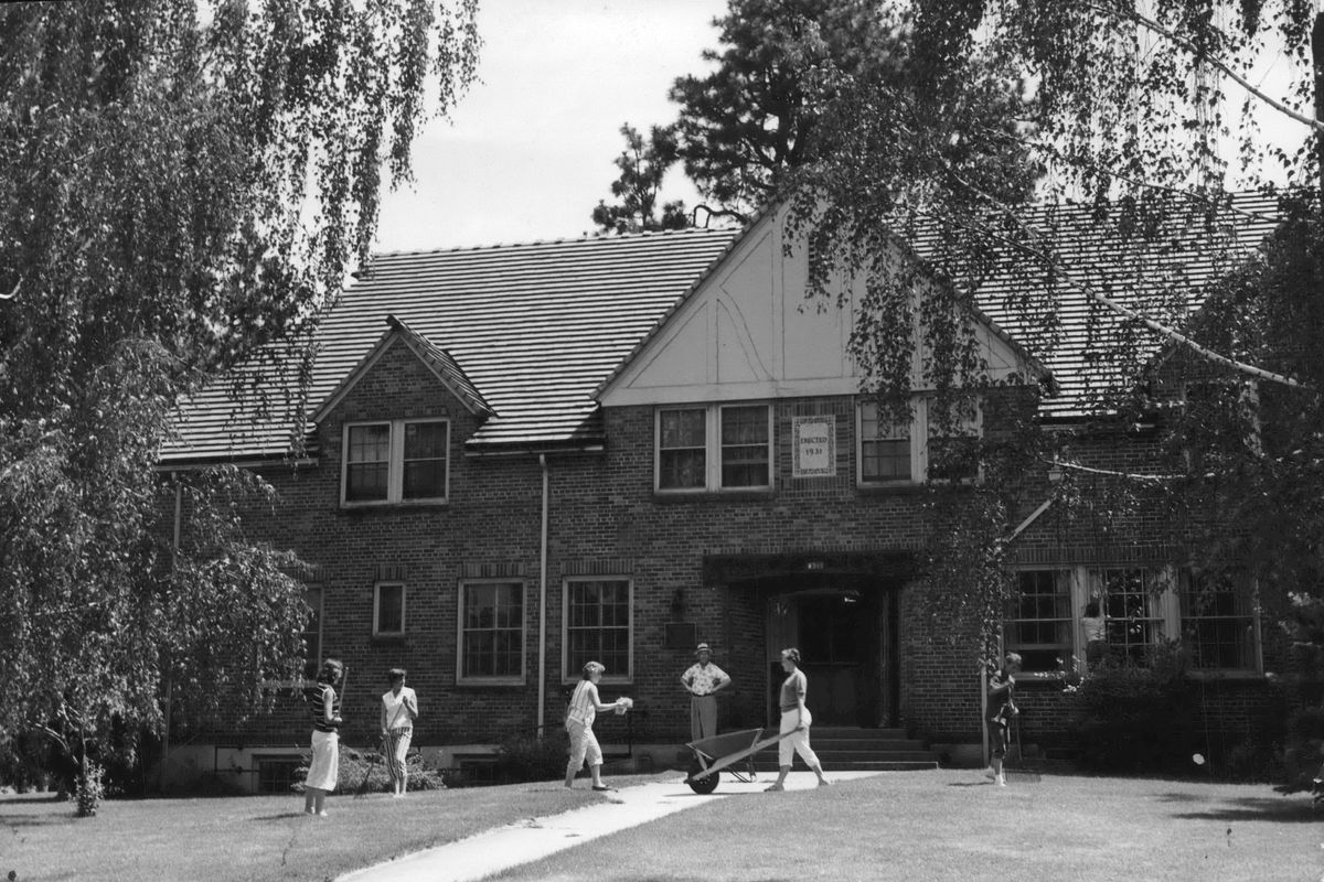 1957: Volunteers clean up the grounds around the Washington Children’s Home Society’s Galland Hall. The home, built in 1931, served as a “reception home” for abandoned or neglected children referred to the home for care. Most of the funds for the home came from the estate of businessman Julius Galland (1860-1926).  (The Spokesman-Review Photo Archive)