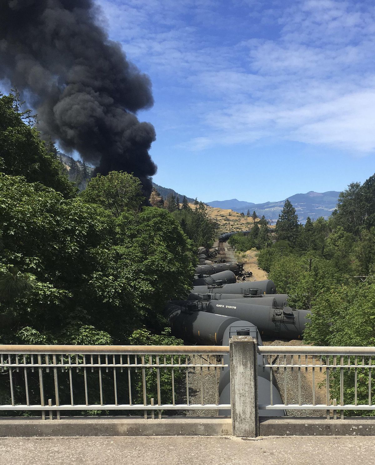 Tank cars, carrying oil, are derailed Friday, June 3, 2016, near Mosier, Ore. Federal investigation on Thursday said the Union Pacific Railroad was responsible for the derailment having failed to maintain its tracks. (Silas Bleakley / Associated Press)