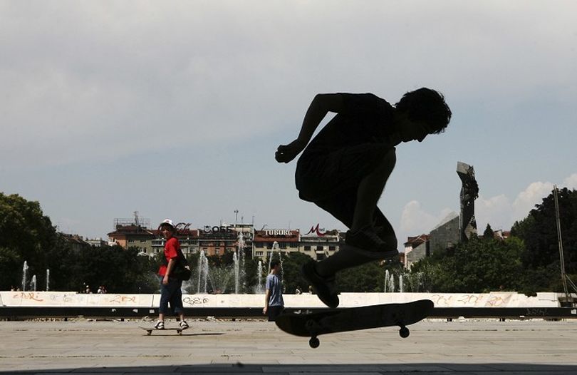 Teenage skateboarders enjoy their summer vacation as they train new tricks in downtown of the Bulgarian capital Sofia, Wednesday, June 11, 2008. (AP Photo/Valentina Petrova) ORG XMIT: XPP102 (Valentina Petrova / The Spokesman-Review)