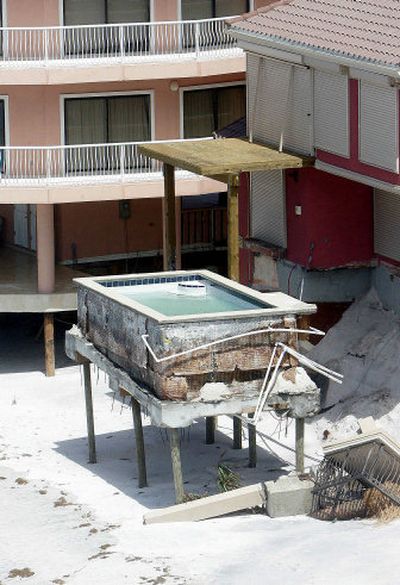 
A swimming pool stands alone on the beach near Destin, Fla., after having been separated from the building complex by Hurricane Dennis. 
 (Associated Press / The Spokesman-Review)