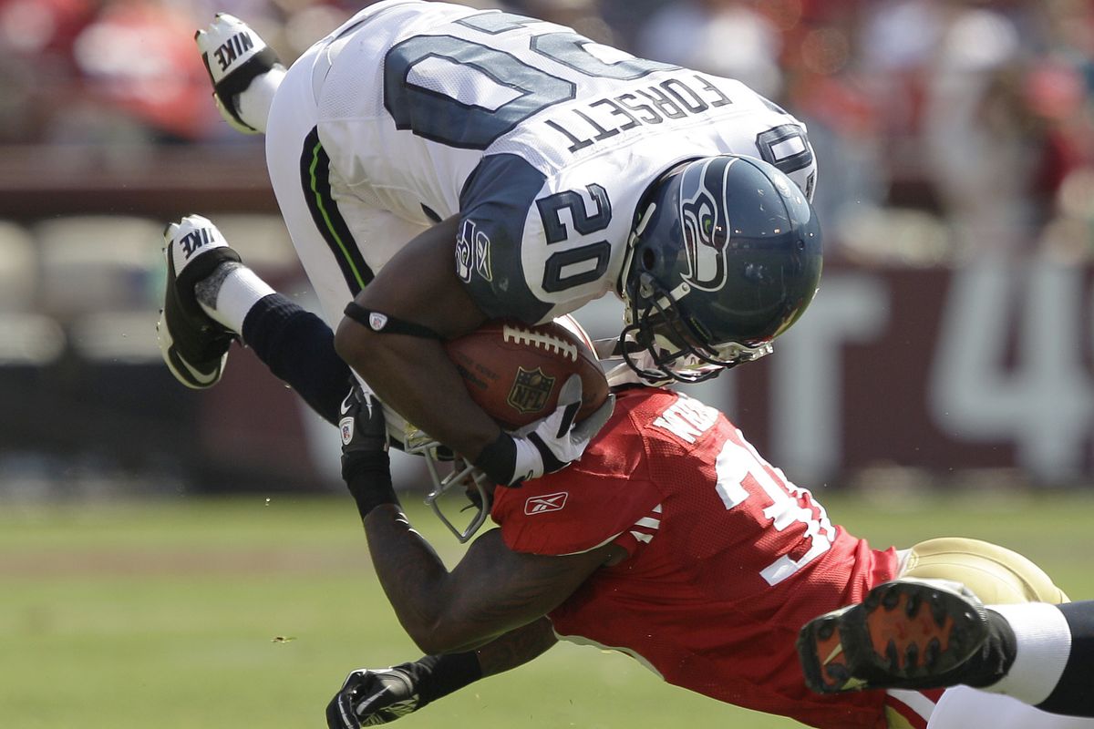 San Francisco’s Donte Whitner brings down Seattle’s Justin Forsett during the third quarter. (Associated Press)