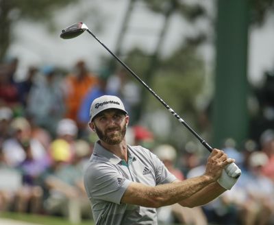 Dustin Johnson hits from the third tee during the third round for the Masters golf tournament Saturday, April 13, 2019, in Augusta, Ga. (Charlie Riedel / Associated Press)