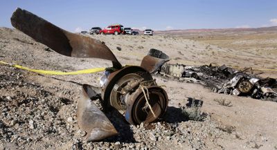 Burned wreckage of the small plane lies on a hillside  northwest of Moab, Utah, on Saturday.  (Associated Press / The Spokesman-Review)