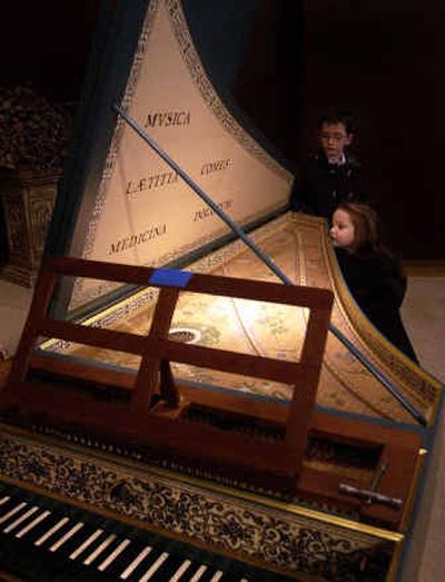 
Anna Hadfield, 3, bottom, and her brother Samuel, 8, check out the harpsichord at the end of the Super Bowl Bach free community concert at the Mary Queen Catholic Church in Spokane on Sunday. 
 (Liz Kishimoto / The Spokesman-Review)