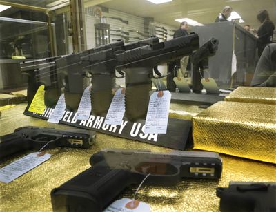 Hand guns are seen for sale at Capitol City Arms Supply Wednesday, Jan. 16, 2013 in Springfield, Ill. President Barack Obama launched the most sweeping effort to curb U.S. gun violence in nearly two decades, announcing a $500 million package that sets up a fight with Congress over bans on military-style assault weapons and high-capacity ammunition magazines just a month after a shooting in Connecticut killed 20 school children. (Seth Perlman / Associated Press)