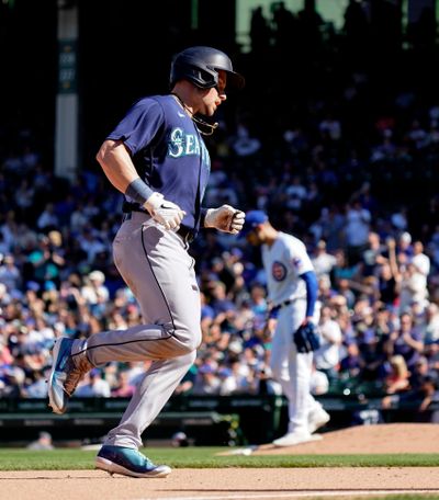 Seattle’s Jarred Kelenic rounds the bases following a home run off of Chicago pitcher Julian Merryweather during the eighth inning at Wrigley Field in Chicago on Wednesday. Kelenic has homered in three consecutive games and is batting .351.  (Getty Images)