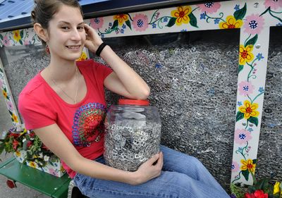 Jenna Dunbar has gathered around 3 million beverage pull tabs over the past five years. They are collected in the Millwood Kiwanis float.  (Dan Pelle / The Spokesman-Review)