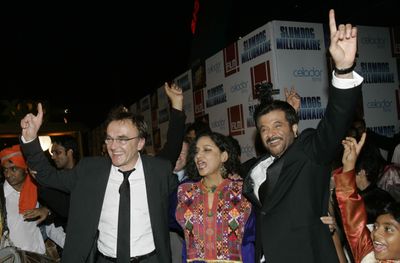 “Slumdog Millionaire” director Danny Boyle, left, and actors Shabana Azmi and Anil Kapoor dance as they arrive for the premiere in Mumbai, India, on Thursday.  (Associated Press / The Spokesman-Review)