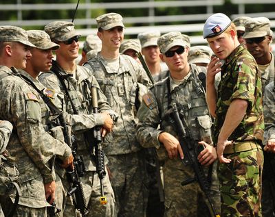 Britain’s Prince Harry, right, speaks with U.S. military cadets Friday during a visit to the United States Military Academy in West Point, N.Y.  (Associated Press)