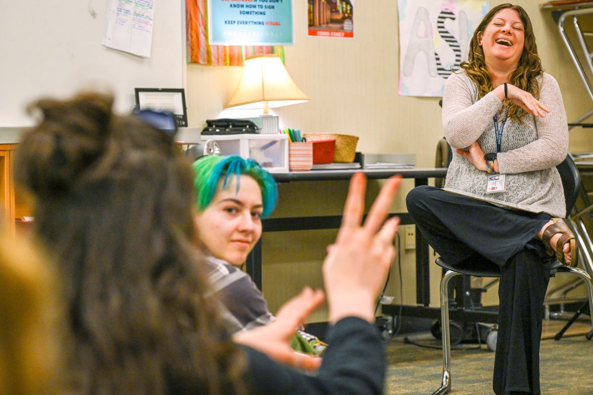 Bethany Hultz, right, the American Sign Language teacher at Ferris High School, gives rules for playing a vocabulary game on April 28 in her American Sign Language III class at Ferris High School. Hultz, who is deaf, relies on interpreters like Kim James and Angie O’Bleness when seeing live performances. (Jesse Tinsley/THE SPOKESMAN-REVIEW)