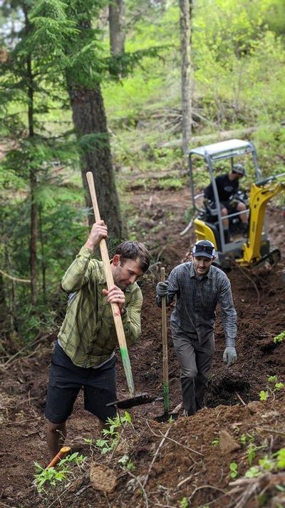 Volunteers work on the Silicate Slide, a mountain bike-specific downhill flow trail in the Mica Peak conservation area. (Evergreen East / COURTESY)