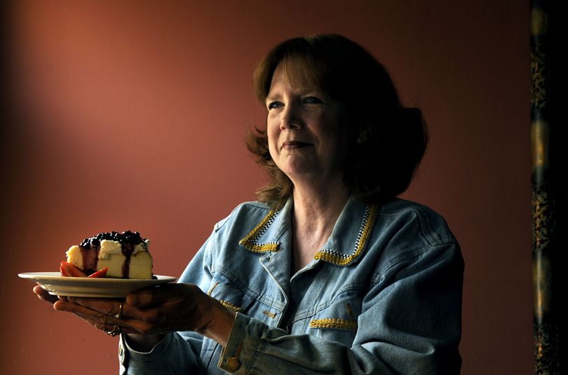 Kris McIlvenna, owner of Greenbriar Inn talked about the many huckleberry products available, including their huckleberry topping that was drizzled on top of cheesecake in Coeur d'Alene on Thursday, July 9, 2009. KATHY PLONKA kathypl@spokesman.com (Kathy Plonka / The Spokesman-Review)
