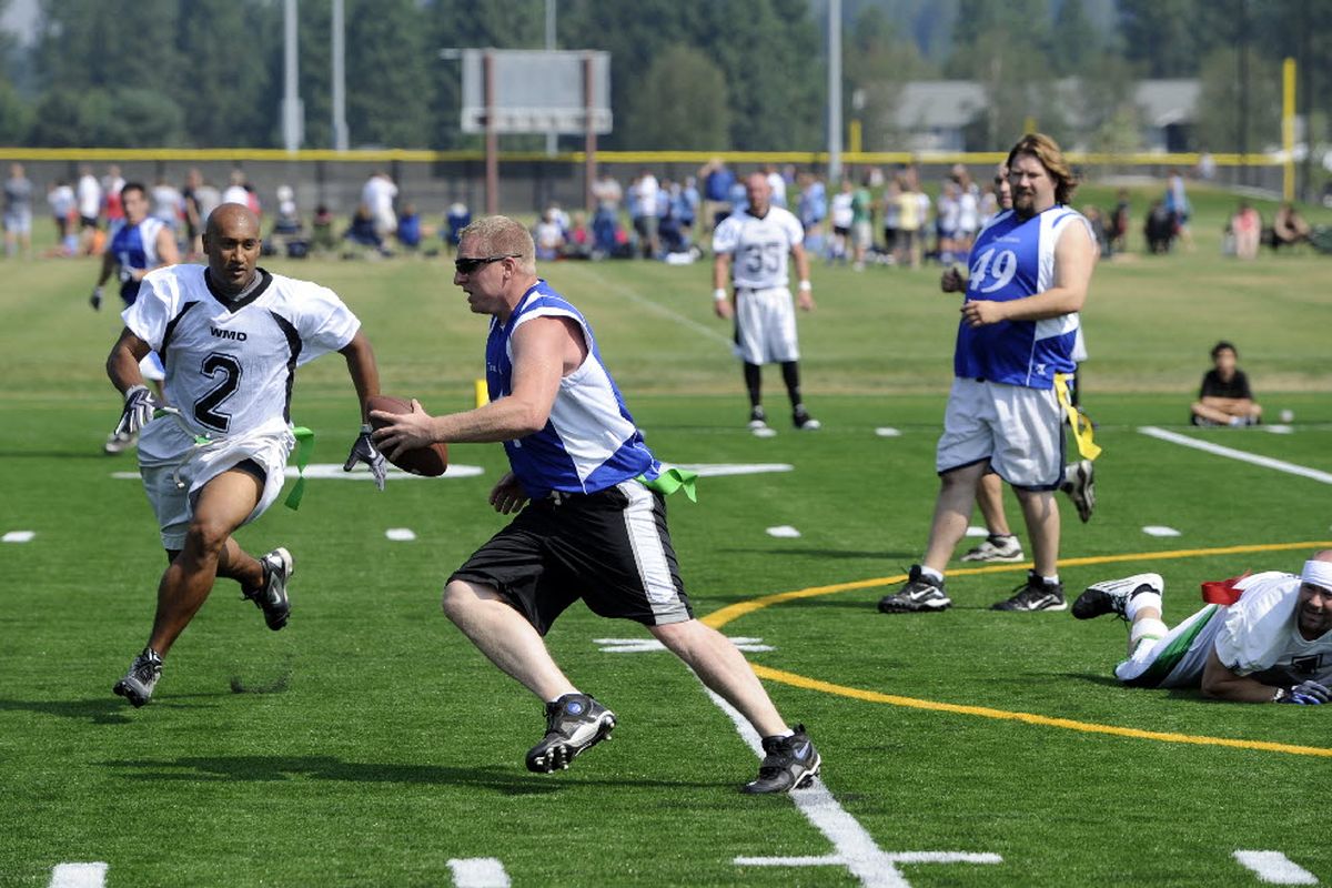 A flag football game takes place on one of the artificial turf fields at the new Dwight Merkel Sports Complex on Saturday, Aug. 7, 2010, the day the ribbon was cut on the expanded sports facility, which has eight soccer fields, along with facilities for several other sports.  (Jesse Tinsley)