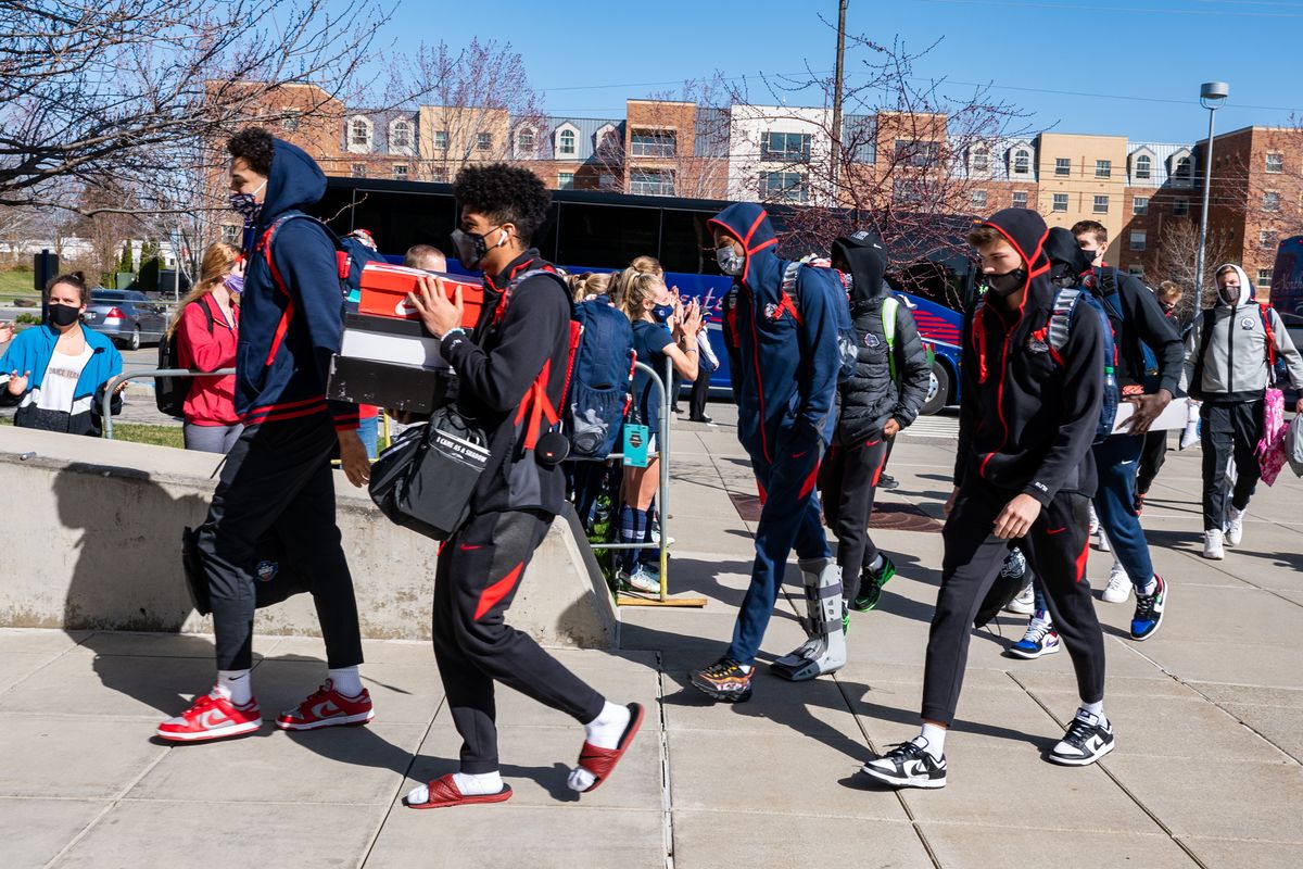 With a small crowd of supporters gathered at McCarthey Athletic Center, the Gonzaga Bulldogs are welcomed home from Indianapolis, Tuesday, April 6, 2021.  (COLIN MULVANY/THE SPOKESMAN-REVI)