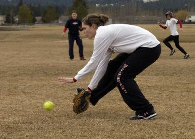 
University High School  three-year first baseman Riki Schiermeister charges a bunt during practice. Schiermeister is the likely lead-off hitter for the Titans.
 (J. BART RAYNIAK / The Spokesman-Review)