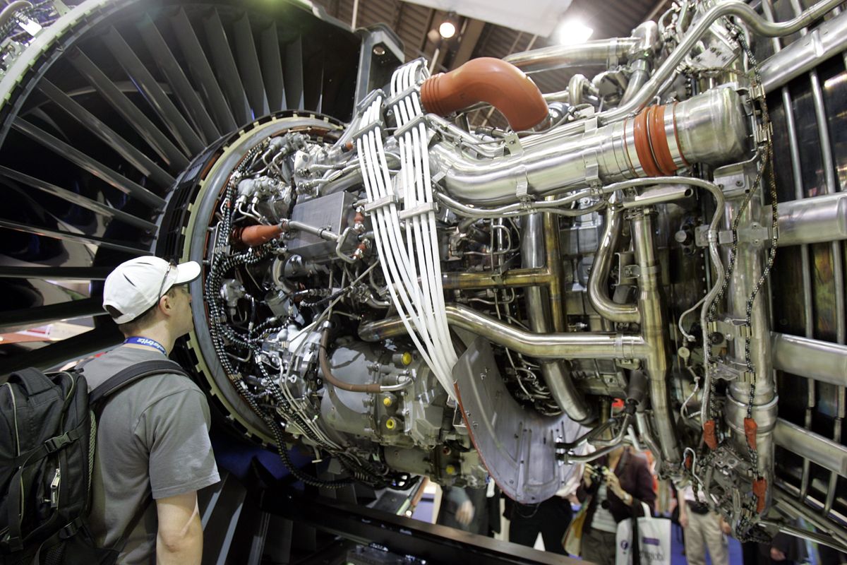 A visitor views a General Electric NX jet engine that will provide power for Boeing’s new 787 Dreamliner, at Le Bourget airport, north of Paris, during the 48th Paris Air Show.  GE  is expected to complete a $30 billion deal that eventually will give control of NBC to cable operator Comcast Corp.Associated Press file photos (Associated Press file photos)