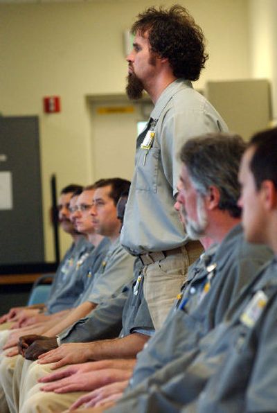 
Stafford Creek Corrections Center inmate Sean Grant stands during a question-and-answer period with other inmates. Grant is part of a 