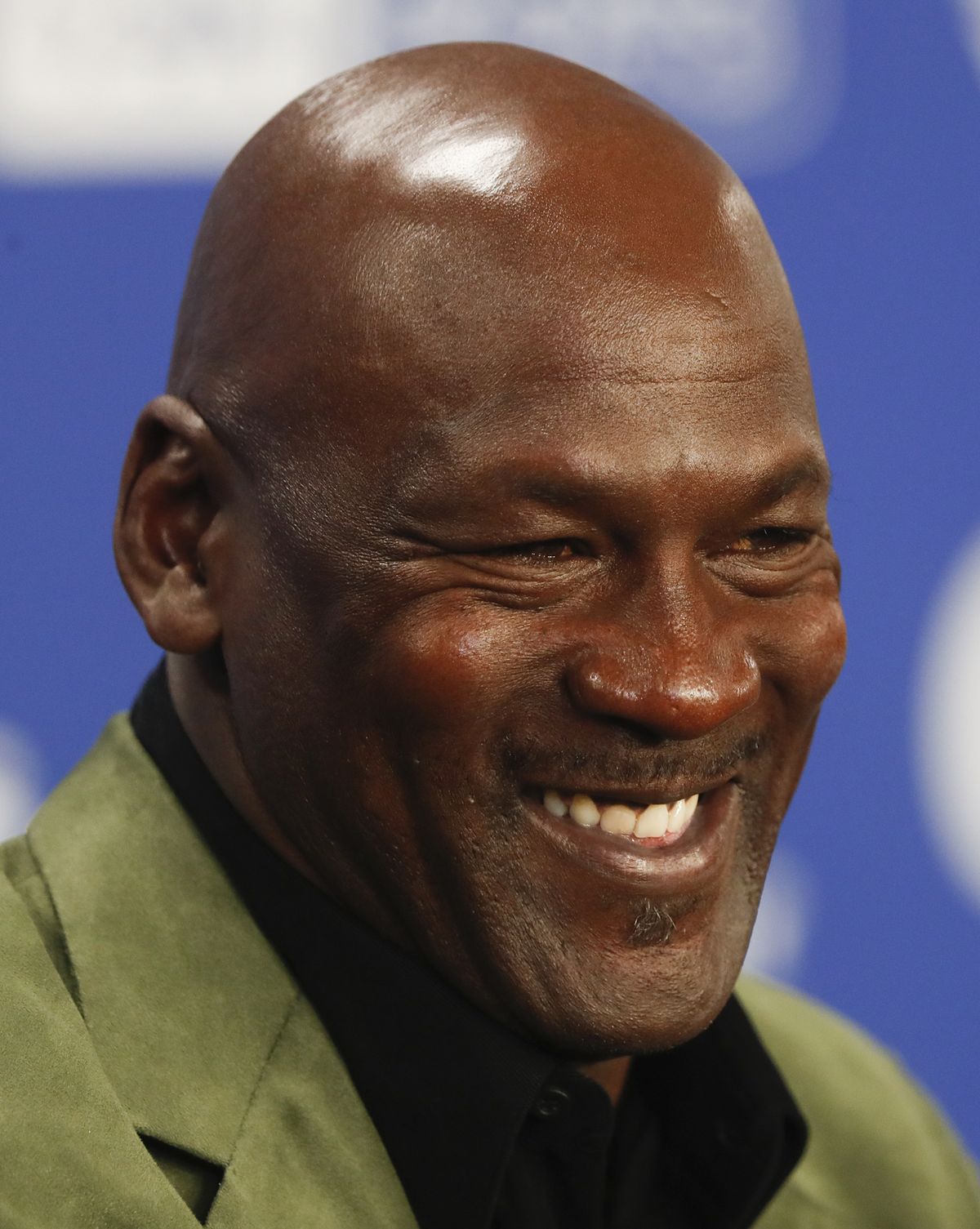 In this Jan. 24, 2020 photo, former basketball superstar Michael Jordan speaks during a news conference ahead of NBA basketball game between Charlotte Hornets and Milwaukee Bucks in Paris. Picking the car number for Michael Jordan's new NASCAR team was a slam dunk: Bubba Wallace will drive the No. 23 car when the team makes its debut next season. Jordan and Denny Hamlin announced last month they had formed a NASCAR team with Bubba Wallace as the driver.  (Associated Press)
